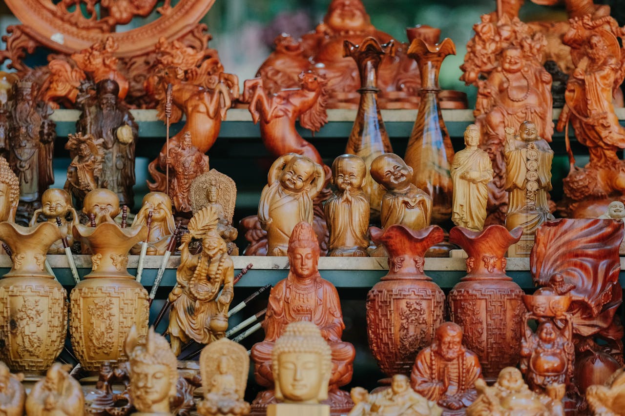 Crafting Captivating Headlines: Your awesome post title goes here Vibrant display of wooden Buddha figurines and vases in a retail store setting.